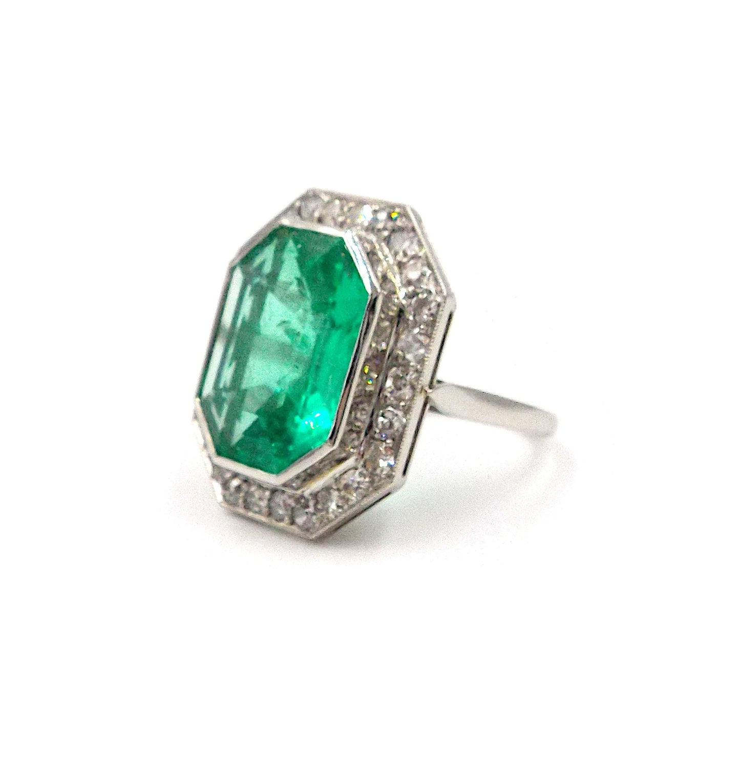 An emerald and diamond ring