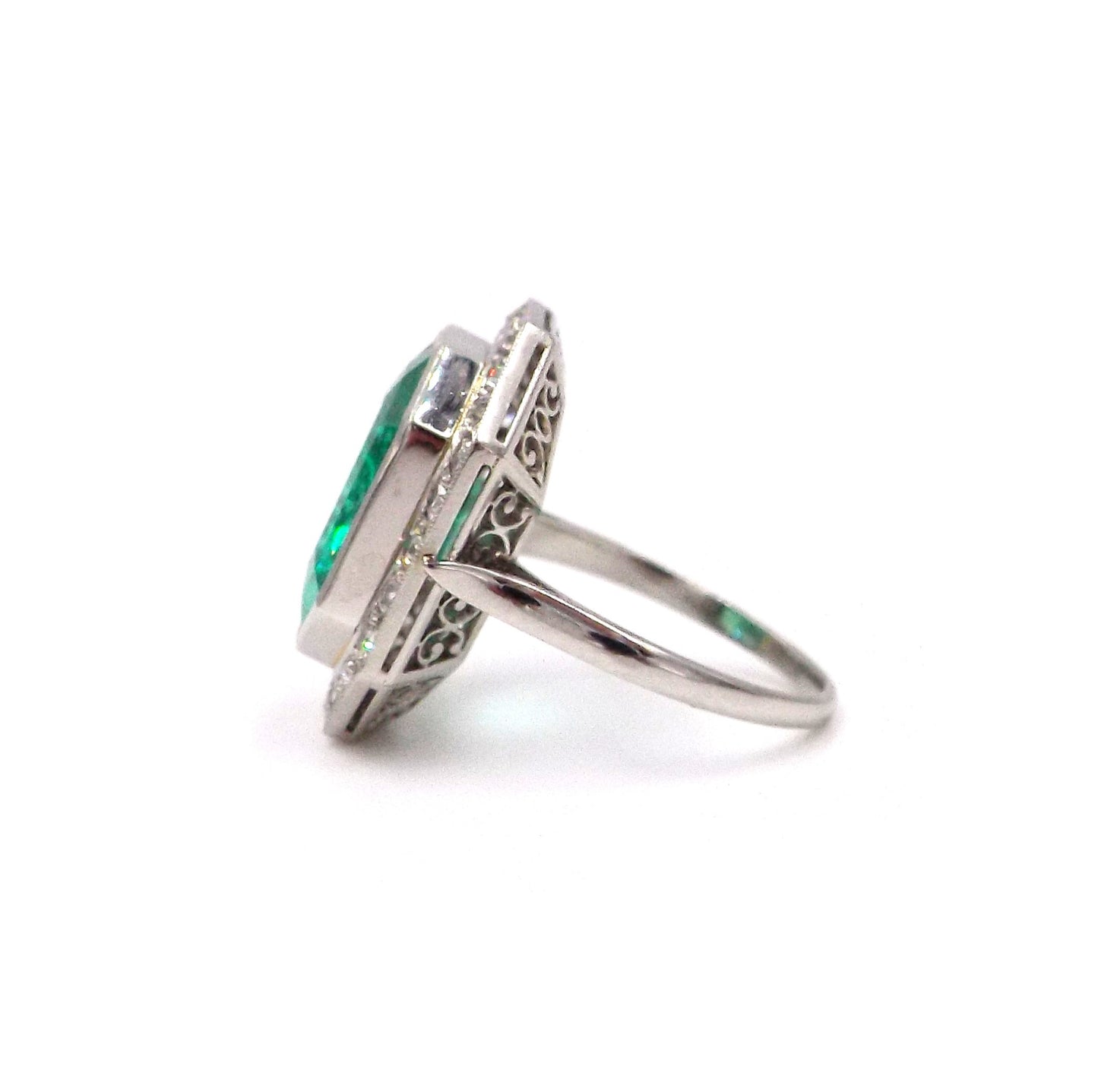 An emerald and diamond ring